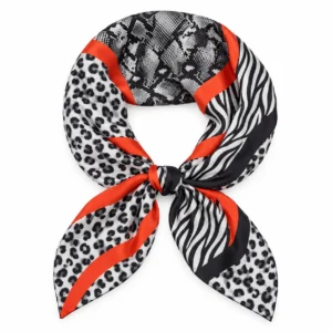 Foulard Léopard Ambre à motifs noirs et gris et bandes orange en boucle arrondie avec un nœud central sur fond blanc