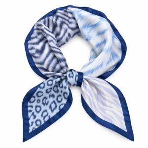 Foulard Léopard Azur bleu et blanc à bordure marine présenté en boucle arrondie avec un nœud central sur fond blanc