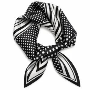 Foulard noir à pois blancs et rayures ivoire noué au centre sur fond blanc